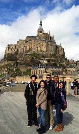 Senior Damon Heine is joined by juniors Teresa Mayorga Solis, Ryan McLaughlin, Paul Spaulding, and Autumn Saldana in front of Mont St. Michel during spring break in France.